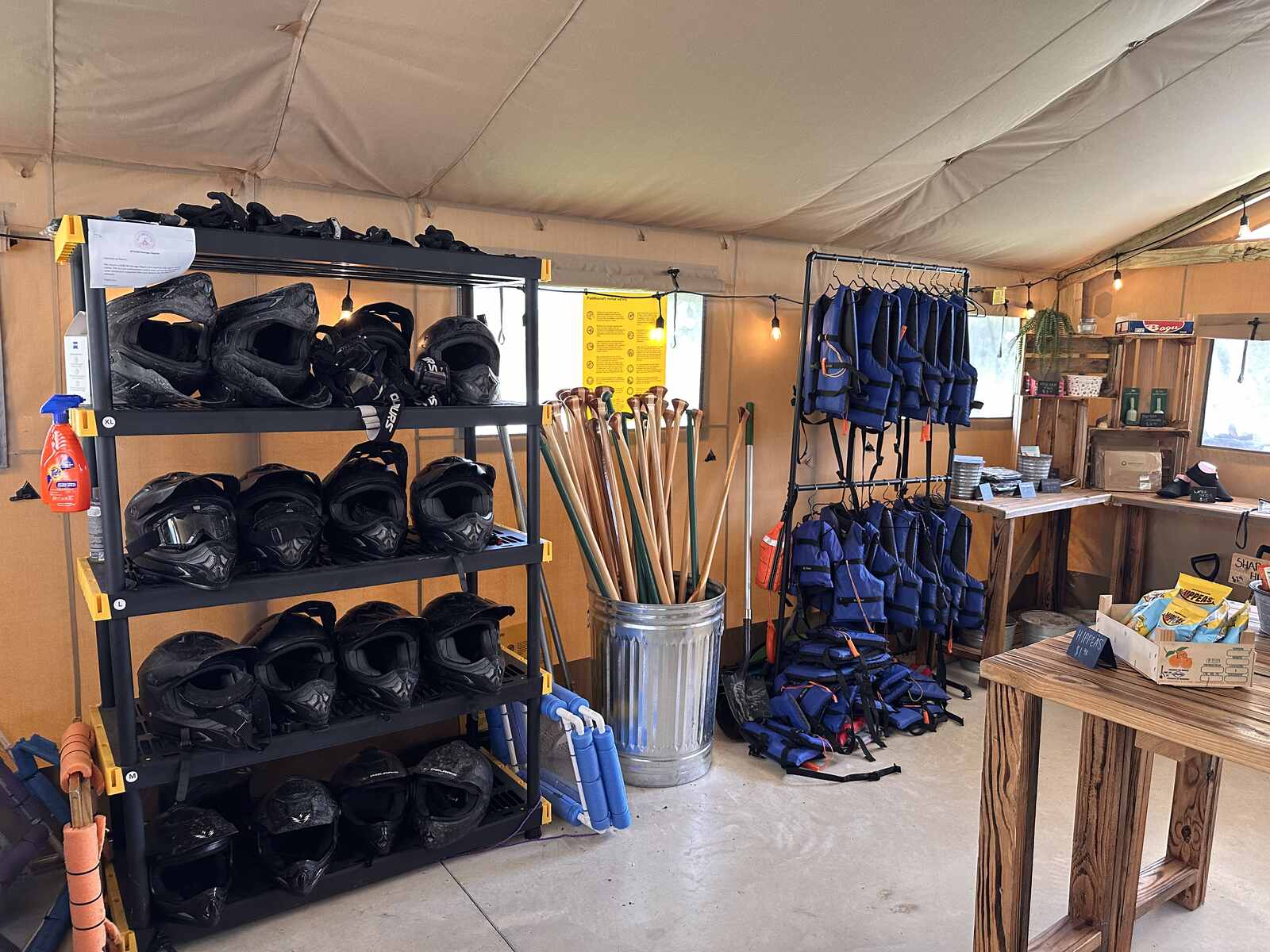 Helmets, life jackets and paddles on the rental shelves at Peace River Oaks, Bowling Green, Florida