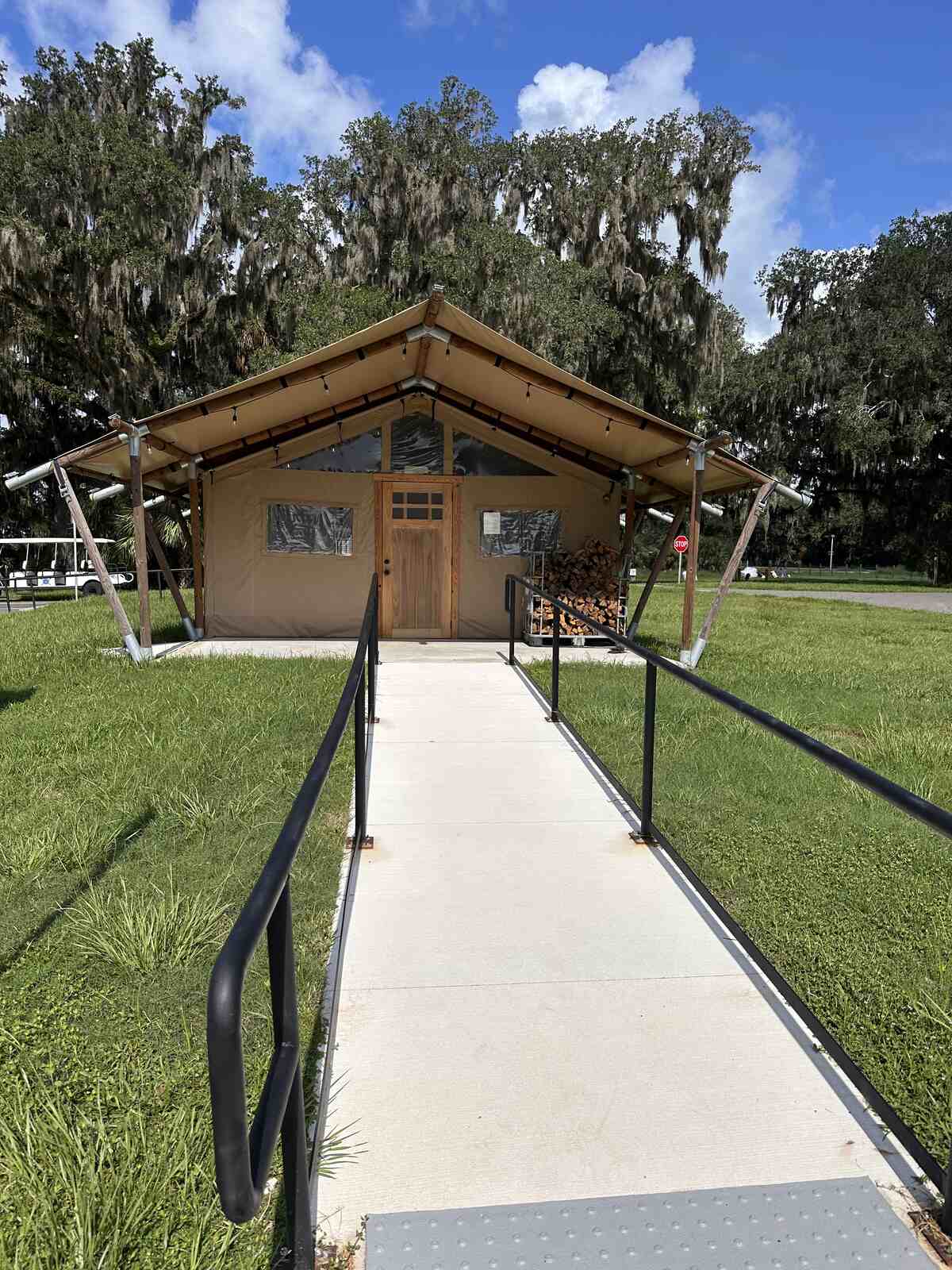 The front porch and ramp of a glamping tent at Peace River Oaks, Bowling Green, Florida