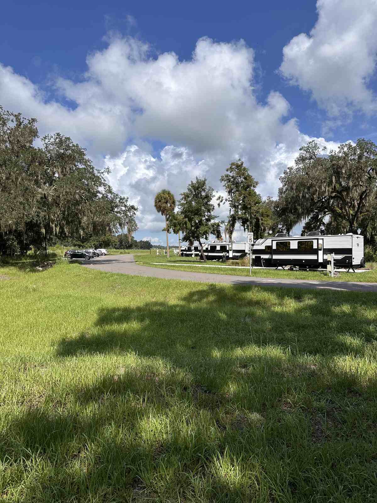 RV sites with concrete pads and open pasture at Peace River Oaks, Bowling Green, Florida