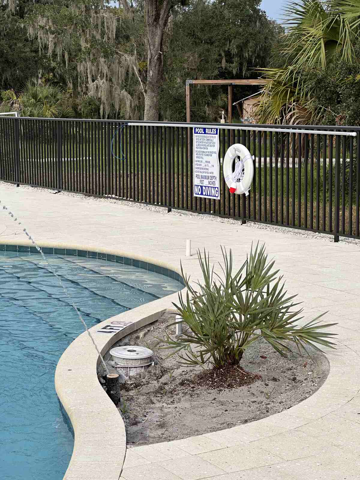 The blank pool rules sign at Peace River Oaks, Bowling Green, Florida, with pool hours and depth left unfilled